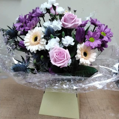 Ashleigh - A budding delight, complimented by greenery and presented in a gift box/bag. Beautiful flower bouquet hand delivered by the local florist.
